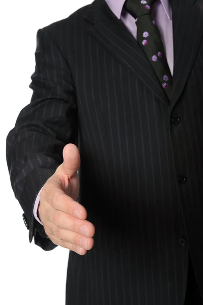 Człowiek w garniturze trzyma rękę na uścisk dłoni. — Zdjęcie stockowe