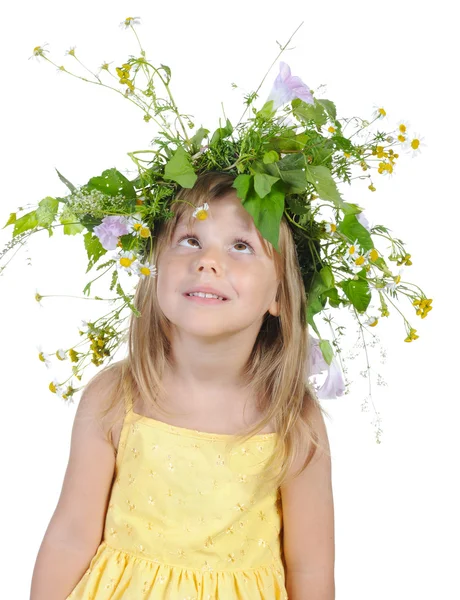 Playful girl with a wreath of flowers. — Stock Photo, Image