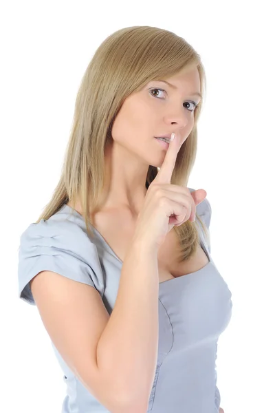 Woman with finger on lips Stock Image
