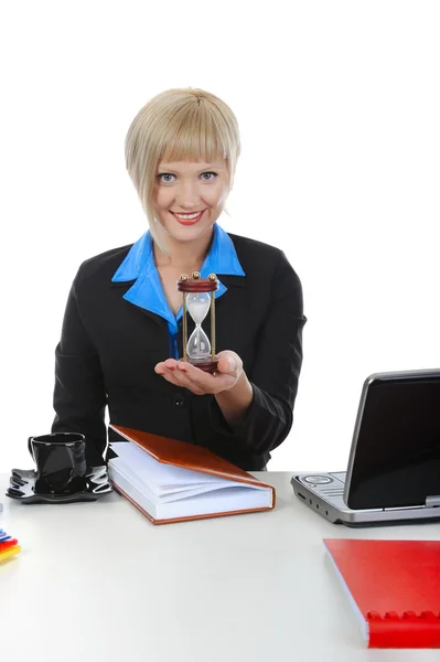 Businesswoman with an hourglass — Stock Photo, Image