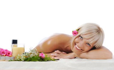Young blonde woman at spa procedure clipart