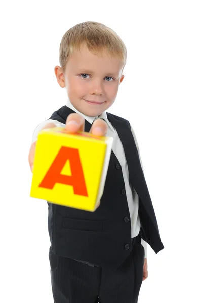 Boy holds a cube — Stock Photo, Image