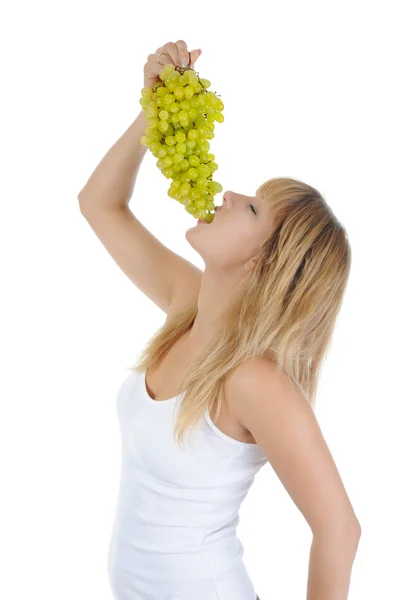 Menina loira comendo uvas — Fotografia de Stock