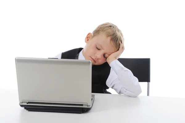 Мальчик заснул за компьютером Лицензионные Стоковые Изображения