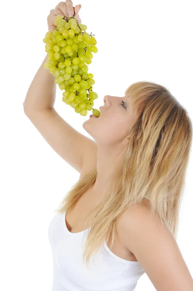 Menina loira comendo uvas — Fotografia de Stock