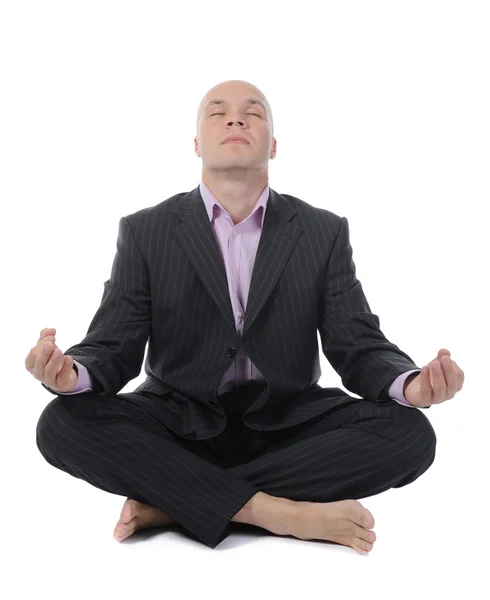 Businessman meditating in yoga lotus — Stock Photo, Image