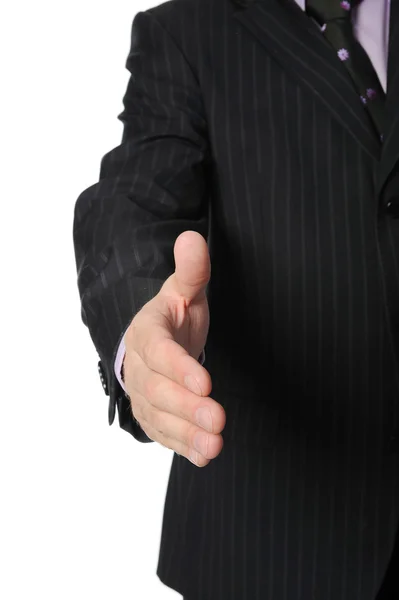 Un homme d'affaires en costume tend la main pour une poignée de main . — Photo
