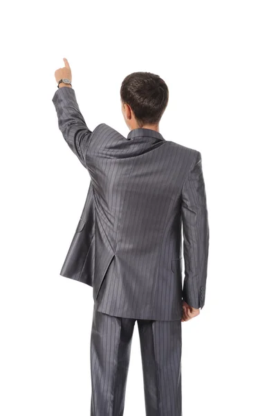 Businessman points finger up — Stock Photo, Image