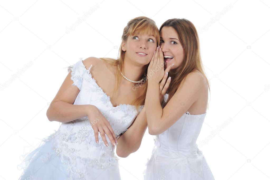 Bride whispers to friend