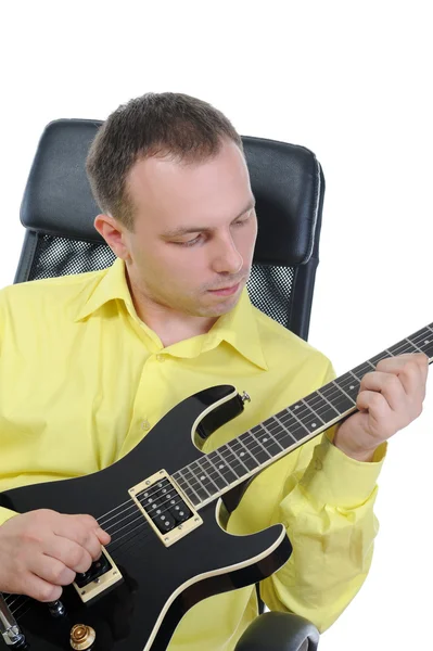 Man with a black guitar. — Stock Photo, Image