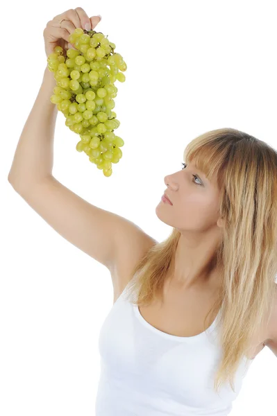 Szőke lány étkezési szőlő — Stock Fotó
