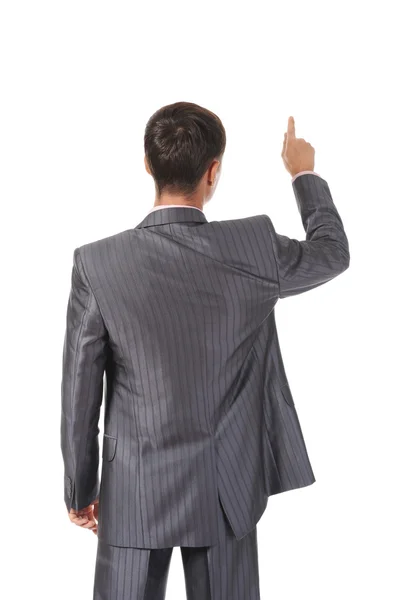Businessman points finger up — Stock Photo, Image