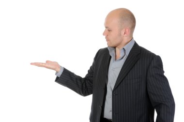 Young businessman holds his hand palm up. clipart