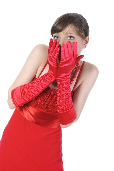 Porträtt av en förvånad tjej i röda handskar. — Stockfoto