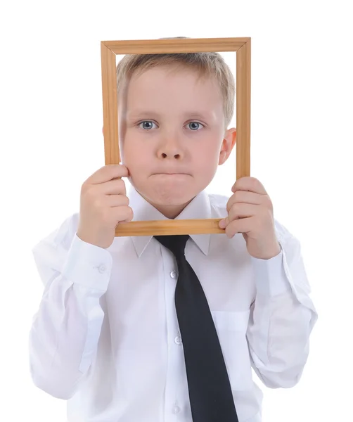 Kleine jongen met een houten frame in zijn handen. — Stockfoto