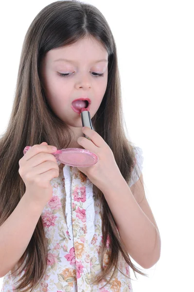 Dziewczynka maluje usta — Zdjęcie stockowe