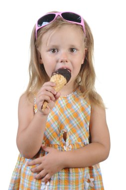 Child eating ice cream. clipart