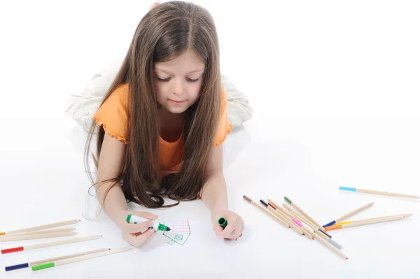 Pequena menina bonita desenha lápis . Imagem De Stock