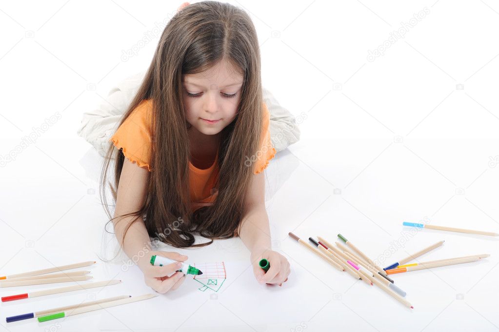Little beautiful girl draws pencils.
