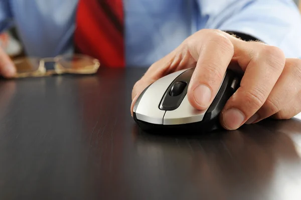 Mouse in hand businessman Stock Photo