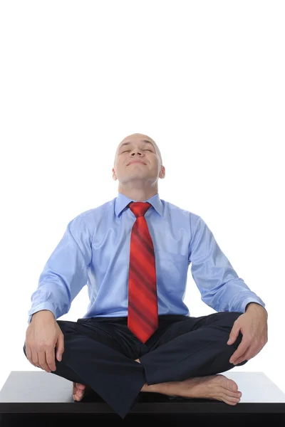 stock image Businessman meditating in yoga lotus