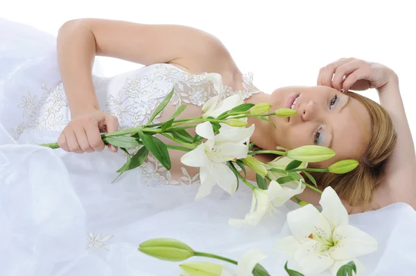 Bride with a bouquet of lilies — Stock Photo, Image