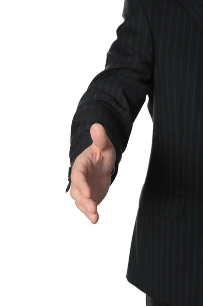 Businessman holds out his hand for a handshake — Stock Photo, Image