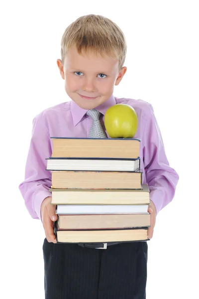 Boy holds a stack of books — Stock Photo, Image