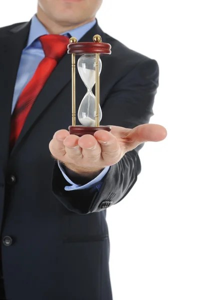 Businessman with hourglass in hand. — Stock Photo, Image