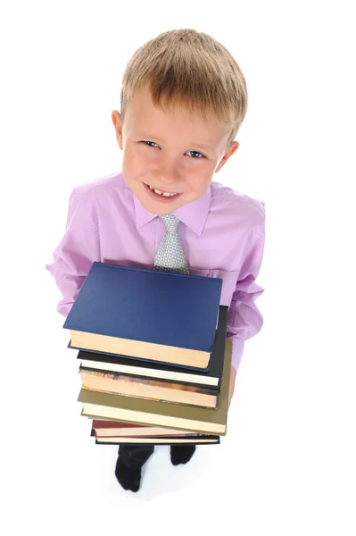 Boy holds a stack of books Stock Photo