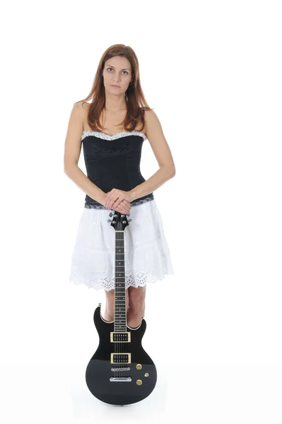 Energetic girl with a black guitar in his hand. — Stock Photo, Image