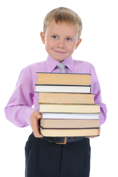 Garçon tient une pile de livres — Photo