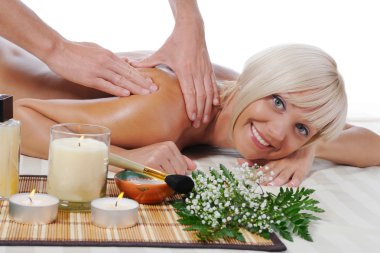 Massage in the spa salon clipart