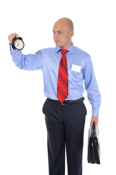 Businessman with an alarm clock in a hand. — Stock Photo, Image