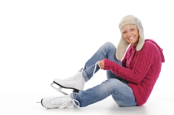 Beautiful girl puts on skates — Stock Photo, Image