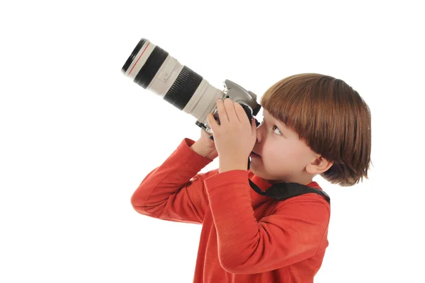 Pojken håller en kamera — Stockfoto