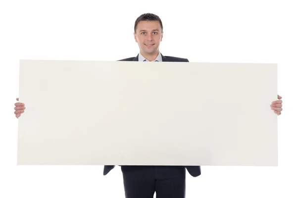 Young man holding blank sheet — Stock Photo, Image