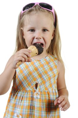 Child eating ice cream. clipart