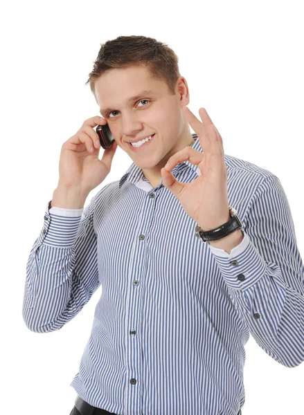 Lachende jonge man praten over de telefoon — Stockfoto
