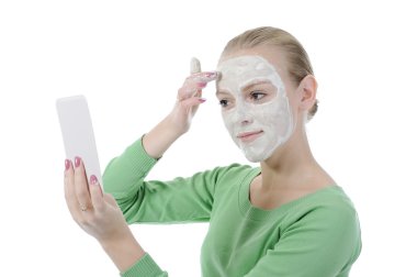 Young woman making a mask clipart