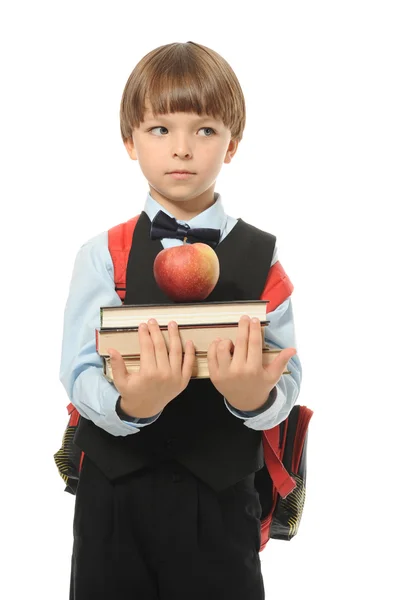 Junge hält einen Stapel Bücher — Stockfoto