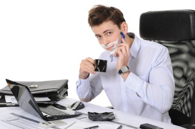 Businessman shaves in the workplace clipart