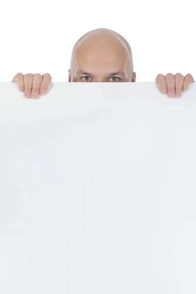Young bald man holding large blank. — Stock Photo, Image