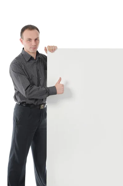 Young man with blank sheet — Stock Photo, Image