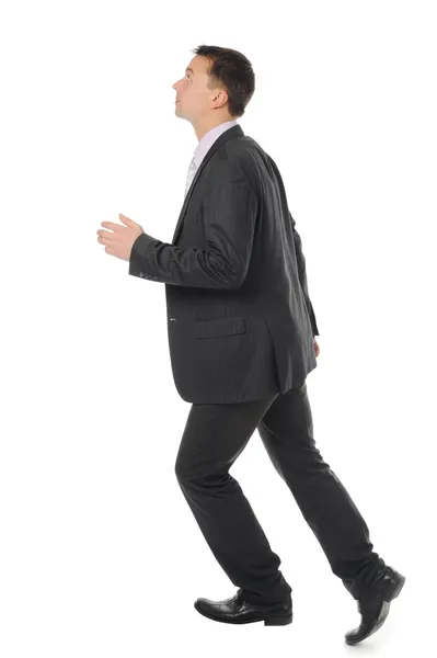 Бизнесмен поднимается по карьерной лестнице — стоковое фото