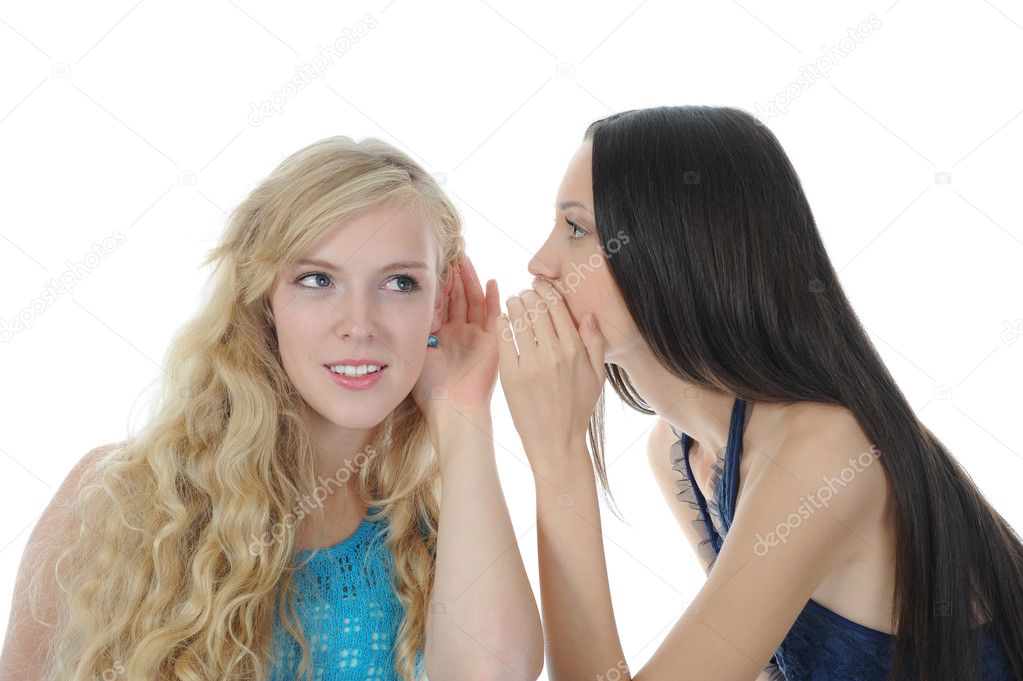 Two beautiful women telling secret