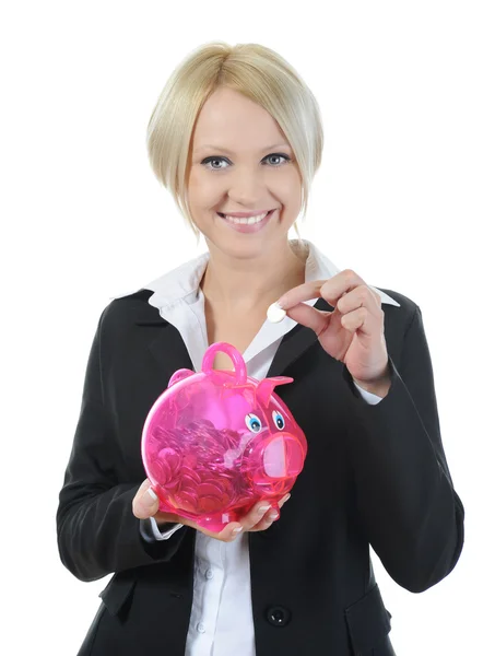 Piękna Młoda Kobieta Wprowadzenie Monet Piggy Bank Białym Tle — Zdjęcie stockowe