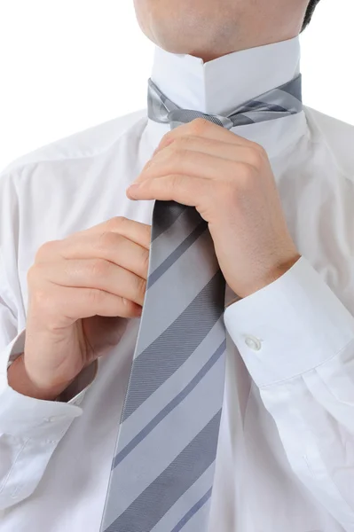 Geschäftsmann Bindet Seine Krawatte Isoliert Auf Weißem Hintergrund — Stockfoto