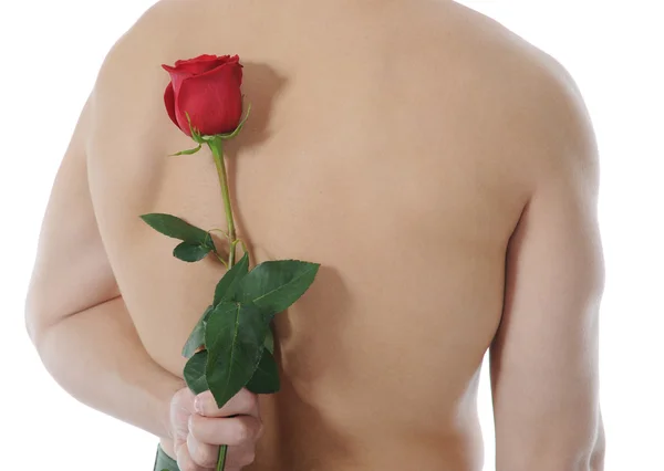 Uomo con in mano una rosa rossa — Foto Stock