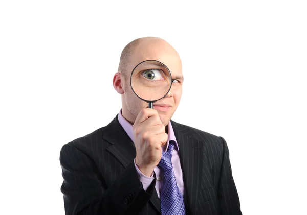 虫眼鏡を通して見るスーツのビジネスマン 白い背景で隔離 — ストック写真